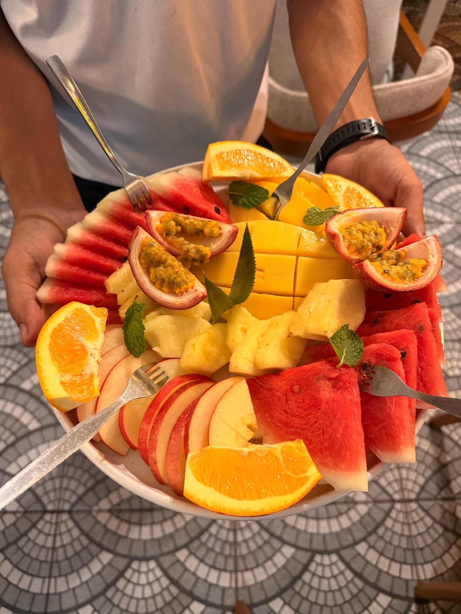 Fresh fruit platter — watermelon, pineapple, orange and passion fruit