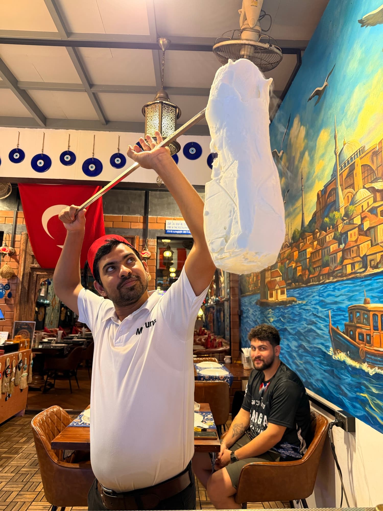 A member of the Mr. TUNA team in the blue-tiled dining room