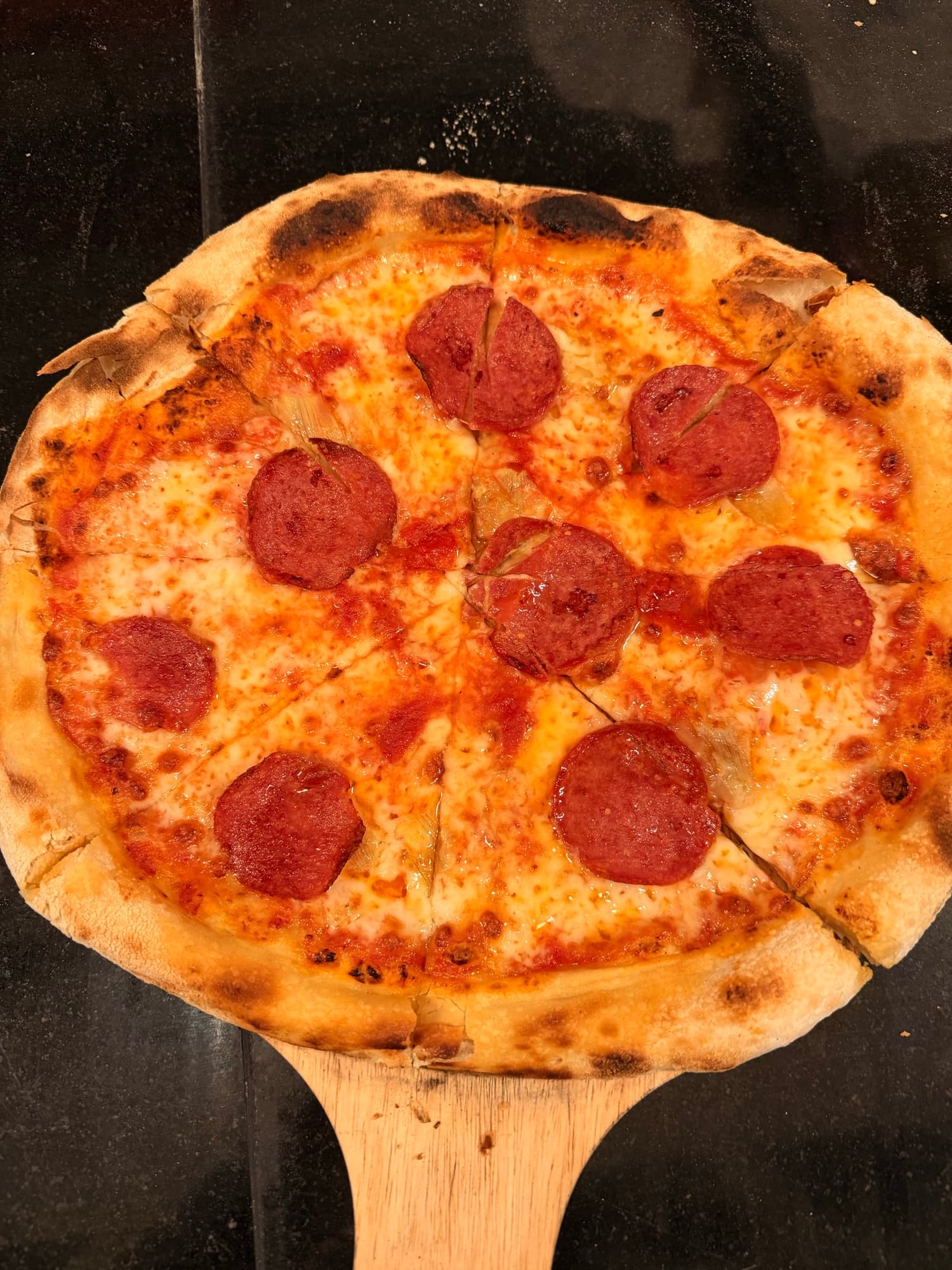 Wood-fired pepperoni pizza
